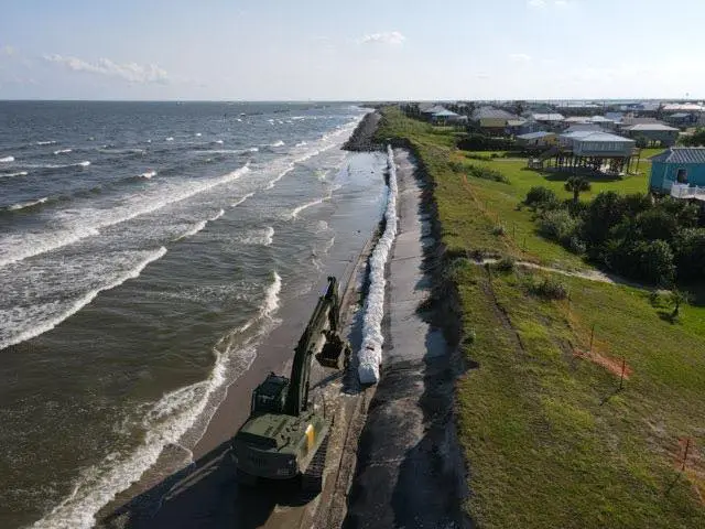 The Louisiana National Guard and local and state agencies reinforce the exposed Burrito Levee in preparation for hurricanes Marco and Laura in 2020.

