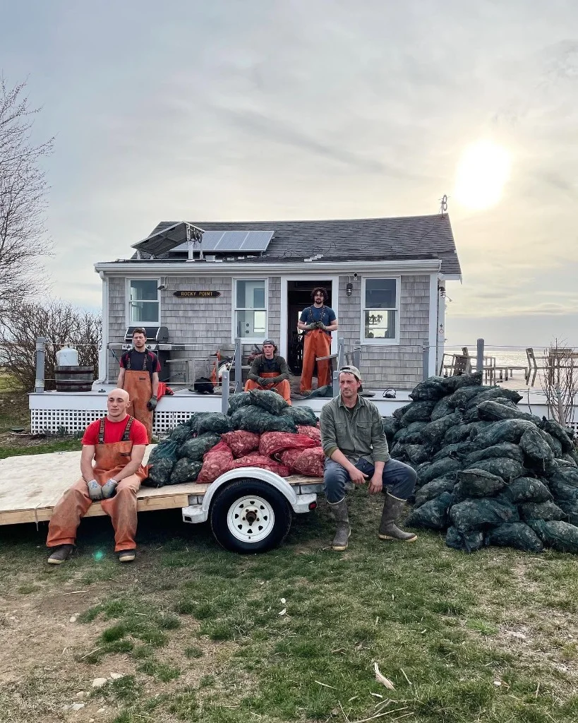 Aunt Dotty's harvest crew with bagged oysters at the Rocky Point cottage, Saquish Neck
