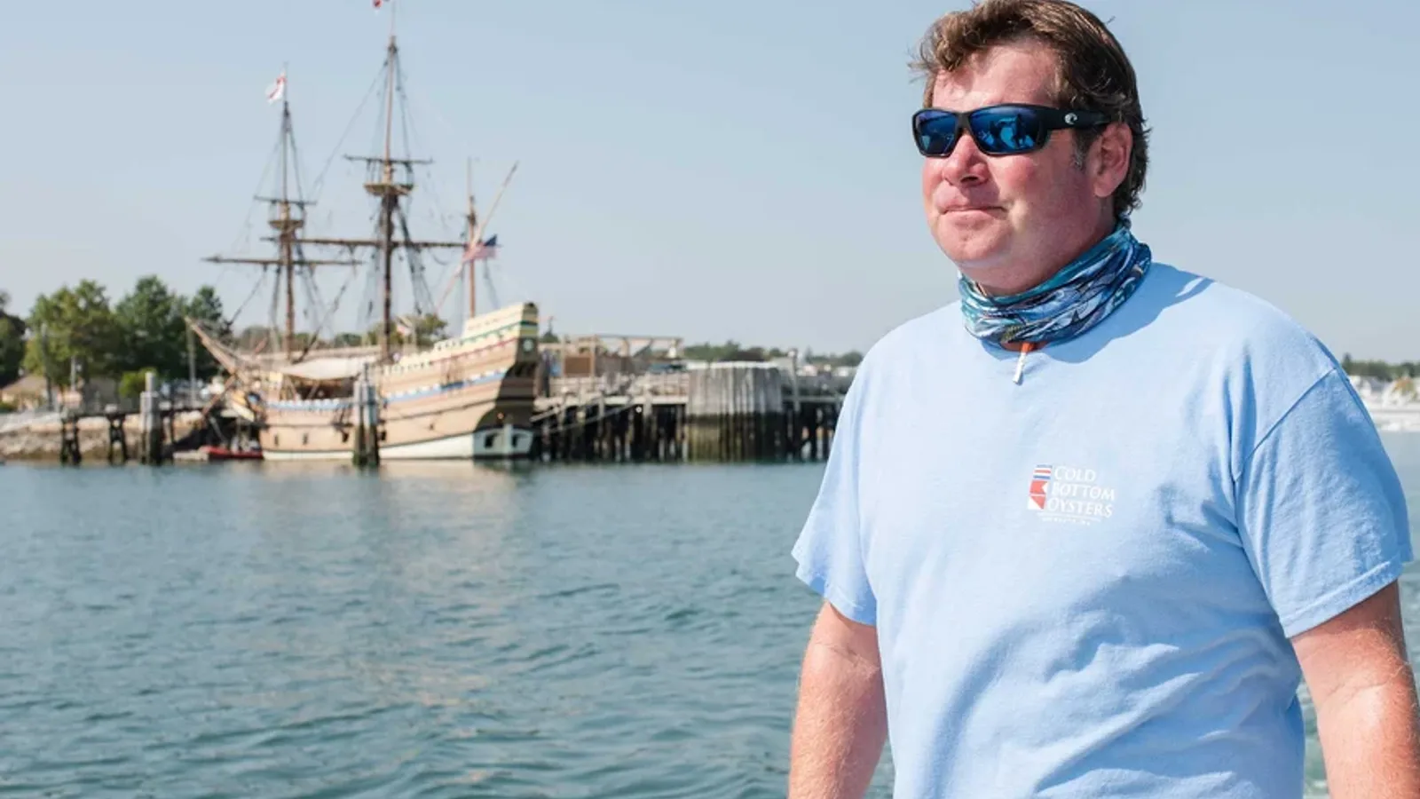 Dave Tarantino on Plymouth harbor in Cold Bottom Oysters shirt — Cape Cod Bay